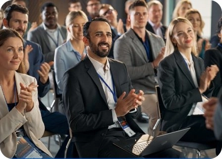 Audience applauding at an Ideas to Action Leadership Talk.